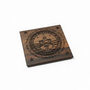 Wooden plaque with engraved text and design on a cardboard background