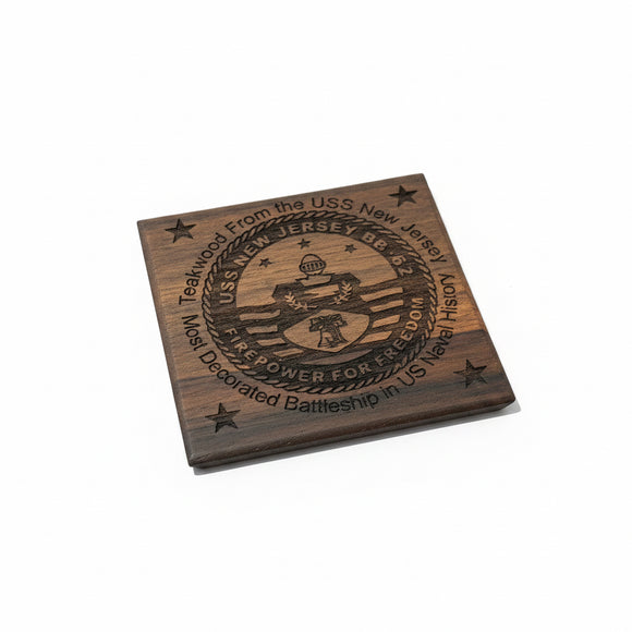 Wooden plaque with engraved text and design on a cardboard background
