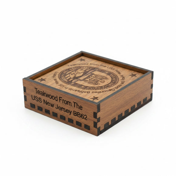 Wooden box with engraved text and design on a beige background