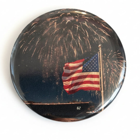 Button badge with American flag and fireworks design on a white background