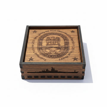 Wooden box with engraved design on a beige wall