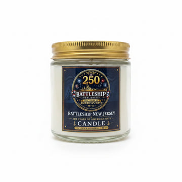 Battleship New Jersey candle with a gold lid on a white background