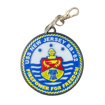A round metal keychain or tag featuring the United States Navy SEALs 'Trident' insignia from USS New Jersey BB-63. The circular tag has a blue and white background with yellow rope border details, blue stars, and a central red and yellow crest.