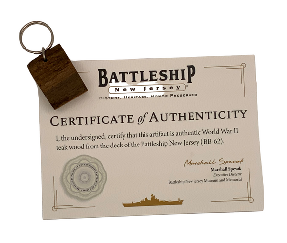 Certificate of Authenticity for World War II teak wood from the Battleship New Jersey with a keychain attached.