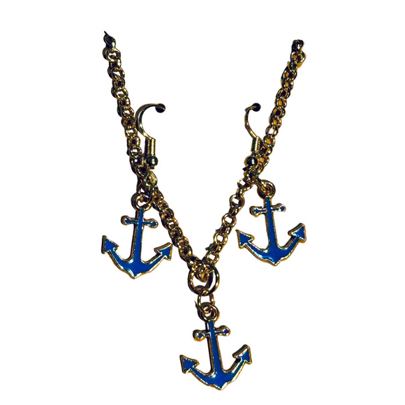 Anchor-shaped earrings on a cardboard backing with a textured surface background