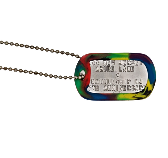Colorful dog tag necklace with engraved text on a white background