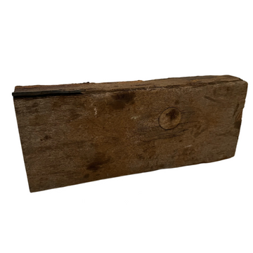 A piece of assorted unfinished teak wood with a rustic and natural appearance.