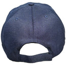 Navy blue baseball cap on a concrete surface