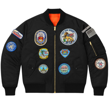 Black jacket with various patches on a white background