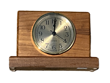 Wooden clock with a silver face on a white background