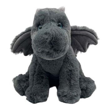 A plush toy resembling a gray dragon with wings, horns, and blue eyes.