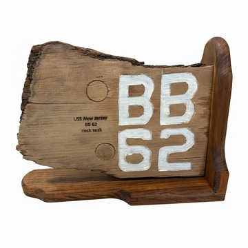 Wooden block with 'BB 62' engraving on a concrete floor