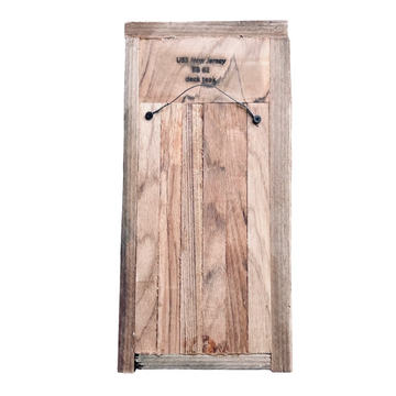 Wooden box with text on a concrete surface