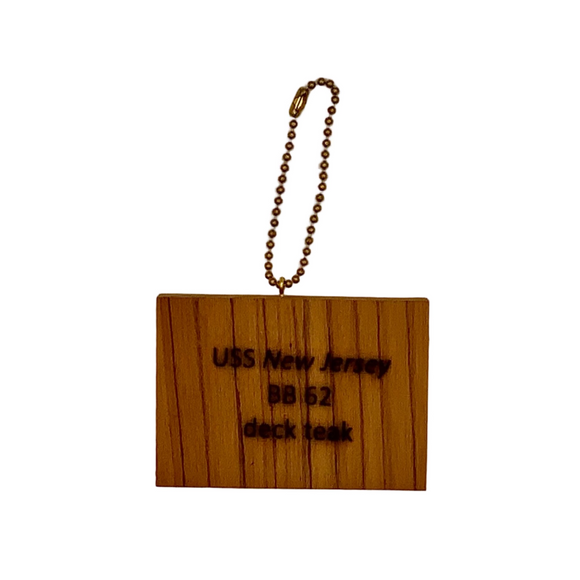 Wooden keychain with text on a plain background