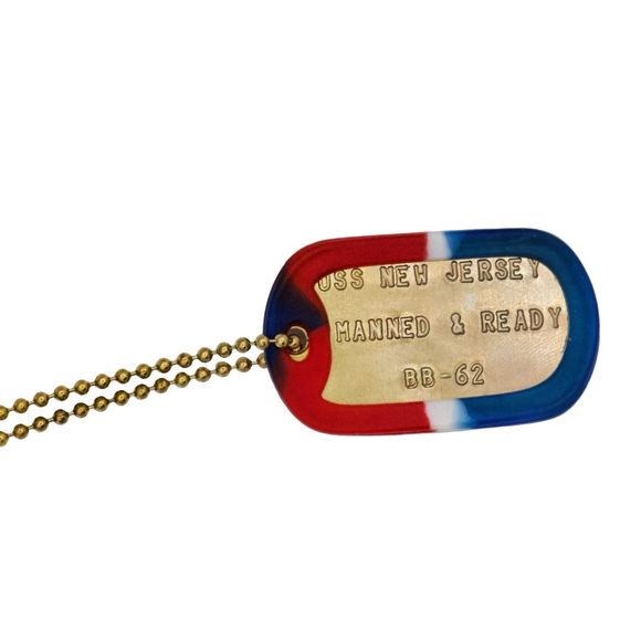 Dog tag with 'USS New Jersey' inscription on a white background