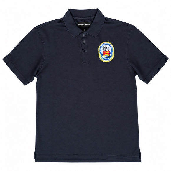 A navy blue short-sleeve polo shirt with a three-button placket and a colorful circular 'Royal Marines Commando' crest patch on the left chest, displayed on a clean white background.