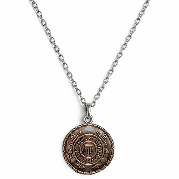 Necklace with a round us coast guard pendant on a white background
