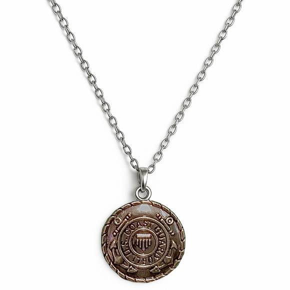 Necklace with a round us coast guard pendant on a white background