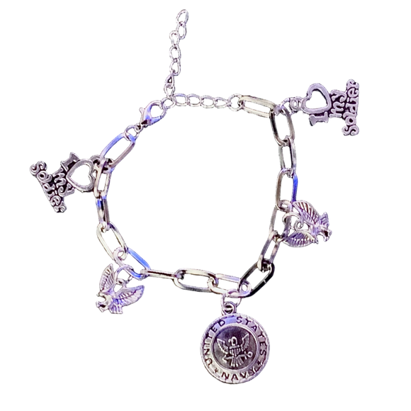 Silver charm bracelet with various charms on a black background